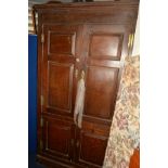 A GEORGIAN OAK FLOOR STANDING PANELLED FOUR DOOR CORNER CUPBOARD, width 129cm x depth 69cm x