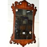 A 19TH CENTURY MAHOGANY SCROLLED FRETWORK WALL MIRROR, 37cm x 63cm