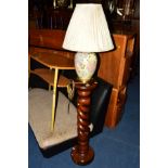 A STAINED HARDWOOD TORCHERE STAND together with a ceramic table lamp and two prints (4)