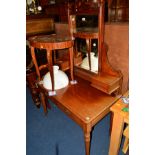 AN EDWARDIAN MAHOGANY DRESSING TABLE with a rectangular mirror between two drawers above two