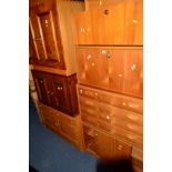 A TEAK FOUR SECTION SHELVING SYSTEM, comprising of a chest of four drawers, two similar fall front