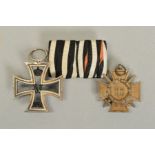 A MOUNTED PAIR OF GERMAN WWI MEDALS, as follows, Iron Cross & Hindenburg Cross with swords marked on