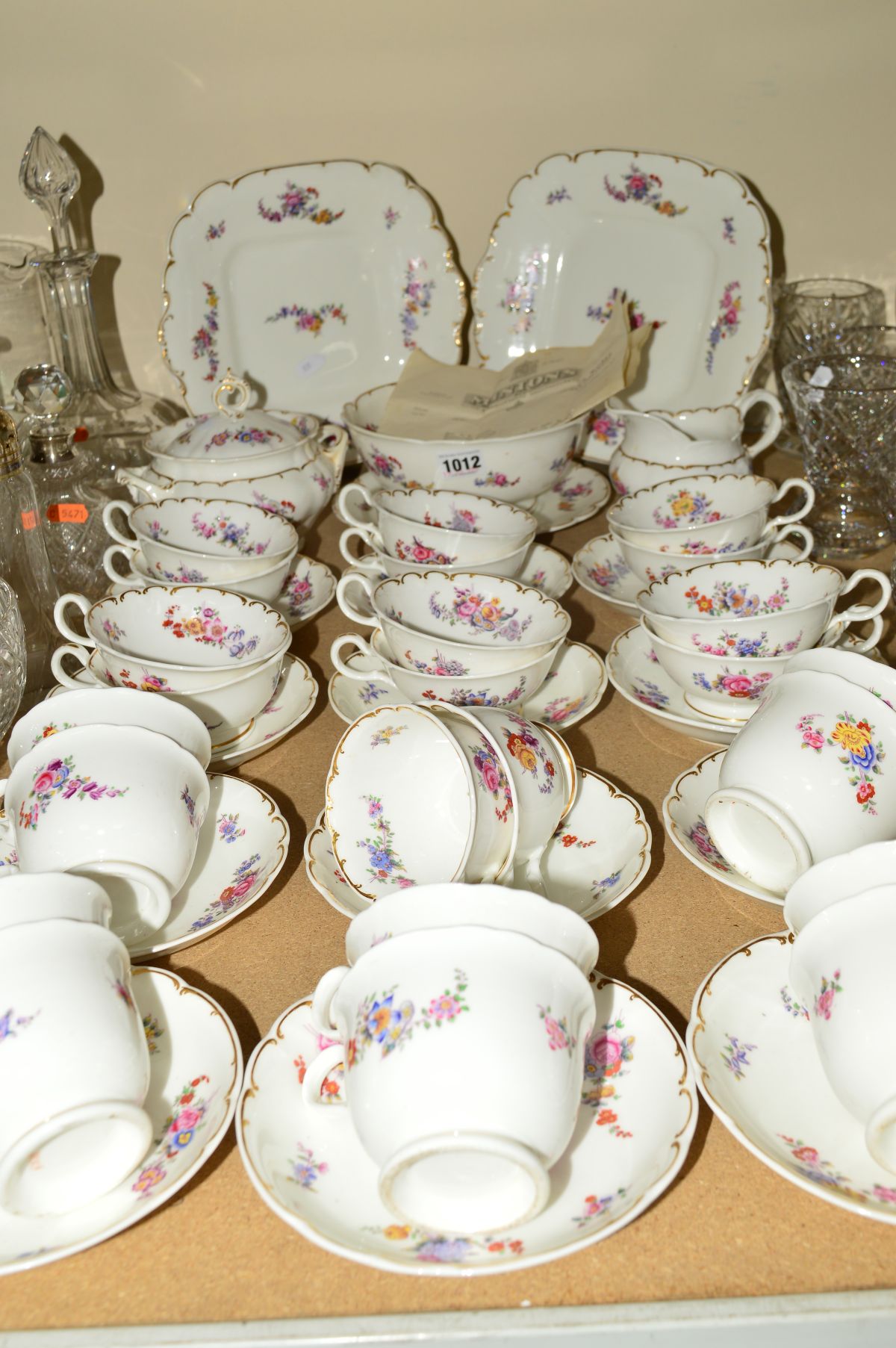 A LATE 19TH CENTURY ENGLISH PORCELAIN TEA SET, printed and tinted with floral sprays, bears