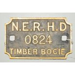 A CAST IRON NORTH EASTERN RAILWAY WAGON PLATE, rectangular with scalloped corners, raised white