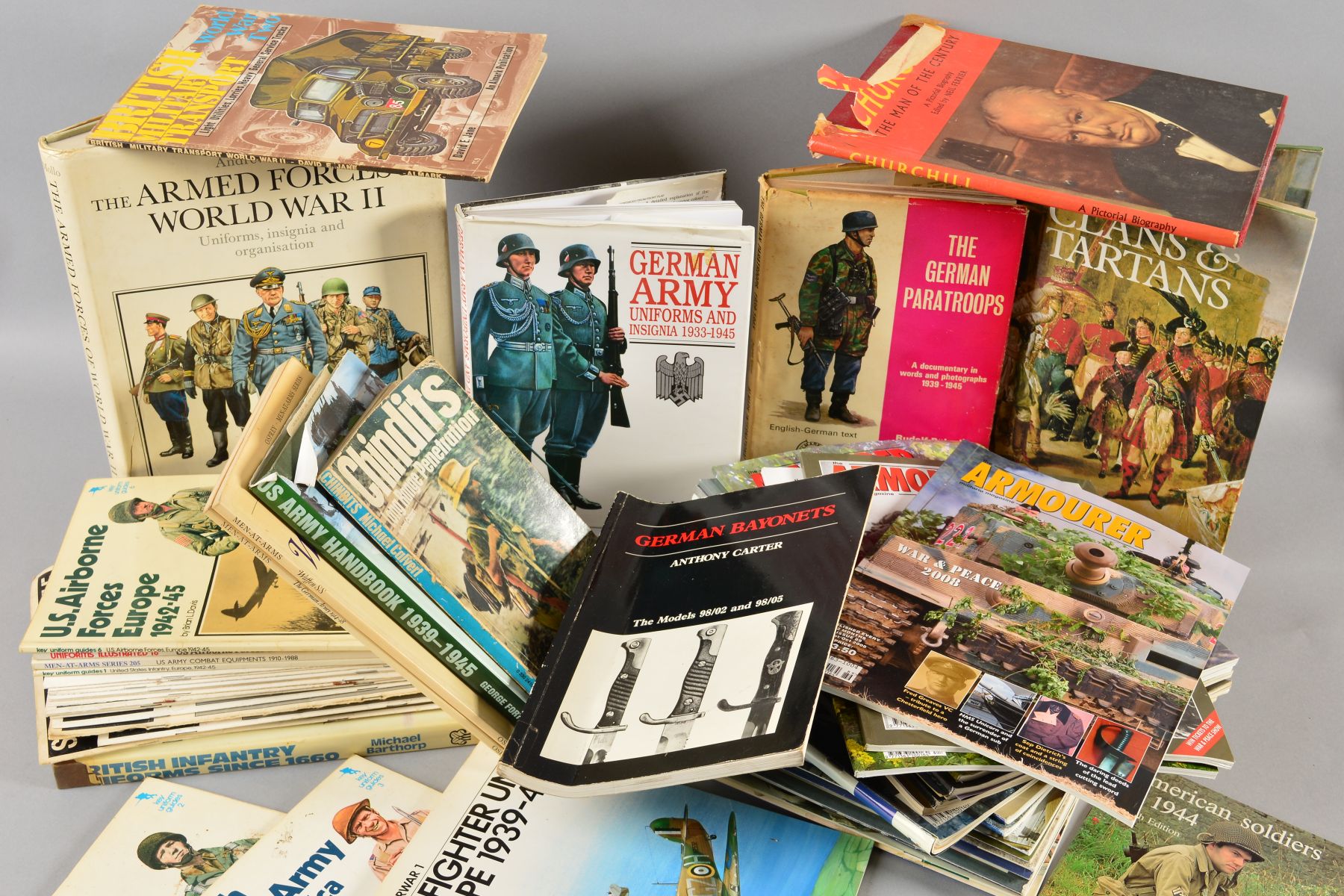 A LARGE PLASTIC BOX CONTAINING VARIOUS BOOKS, MAGAZINES, etc, WWII Military interest, including a