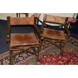 A PAIR OF 1980'S ROSEWOOD AND LEATHER FOLDING DIRECTOR'S CHAIRS, cylindrical armrests and feet,