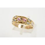 A BI-COLOUR GEM RING, designed as two central pear shape, collet set pink gems, assessed as topaz,