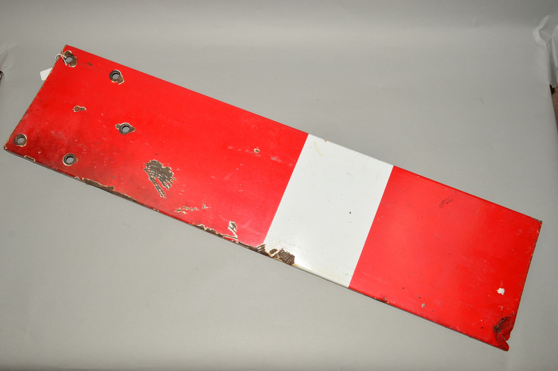 A HOME SIGNAL ARM, marked N.E. Ltd B.R., has some wear, damage, markings and paint loss/rust, length