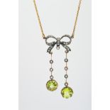 A DIAMOND, SPLIT PEARL AND PERIDOT NECKLACE, the pendant section designed as a diamond set bow