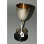 A GEORGE V SILVER TROPHY CUP, plain with beaded foot rim, mounted on a black plastic socle base,