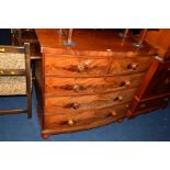 A VICTORIAN FLAME MAHOGANY BOWFRONT CHEST OF TWO SHORT AND THREE LONG DRAWERS on baluster feet,