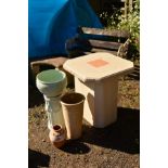 A SQUARE CREAM COMPOSITE GARDEN TABLE with canted corners on a seperate base, height 73cm x width