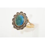 A 9CT GOLD OPAL AND DIAMOND CLUSTER RING, the central oval opal triplet within a scalloped