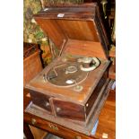 A DISTRESSED OAK CASED WIND UP GRAMOPHONE