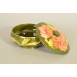 A MOORCROFT POTTERY COVERED POWDER BOWL, 'Hibiscus' pattern on green ground, impressed marks to