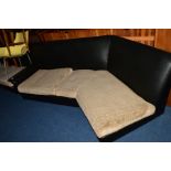 A 1960’S/70’S BLACK VINYL THREE SECTION DOG LEG CORNER SOFA AND MATCHING SINGLE ARMCHAIR, with