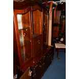 A MAHOGANY DINING SUITE comprising of an extending dining table, six chairs, wall unit, corner