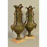 A PAIR OF BRONZED TWIN HANDLE VASES, mounted on a marble plinth, height 44cm (2)