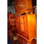 A YEW WOOD TWO TIER STAND, a bowfront bookcase, sideboard with two drawers, two door cabinet, two
