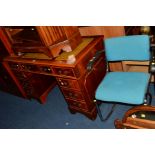 A REPRODUCTION YEW WOOD PEDESTAL DESK, tooled tan leather inset top and nine various drawers,