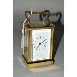 A MAPPIN & WEBB BRASS CARRIAGE CLOCK, with white face, black Roman numeral hour markers and black
