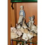 SEVEN LLADRO FIGURES, 'Young Boy with Yacht' No 4810, four cats No 5113, 5112, 5114 and 5091, a bird
