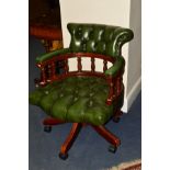 A REPRODUCTION GREEN BUTTONED LEATHER SWIVEL OFFICE CHAIR