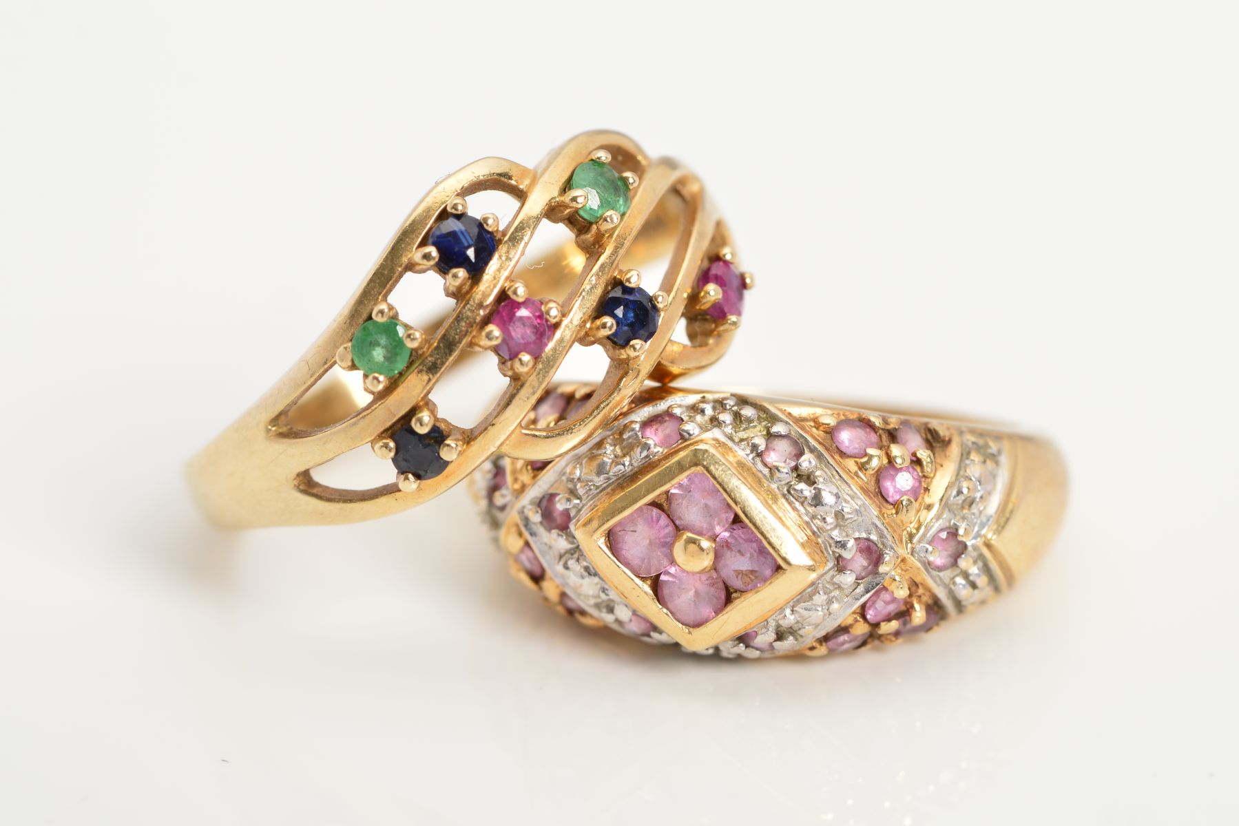 TWO 9CT GOLD GEM RINGS, the first of openwork design claw set with emeralds, sapphires and rubies,