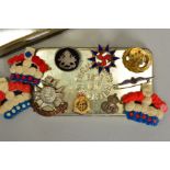 A TIN CONTAINING THE FOLLOWING ITEMS OF MILITARY INTEREST, three handmade red, white and blue