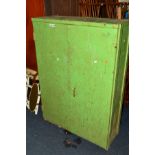 AN INDUSTRIAL GREEN PAINTED TWO DOOR STORAGE CABINET, width 93cm x depth 34.5cm x height 130cm