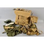 A LARGE KHAKI KIT BAG, containing various items of Military webbing and canvas items including