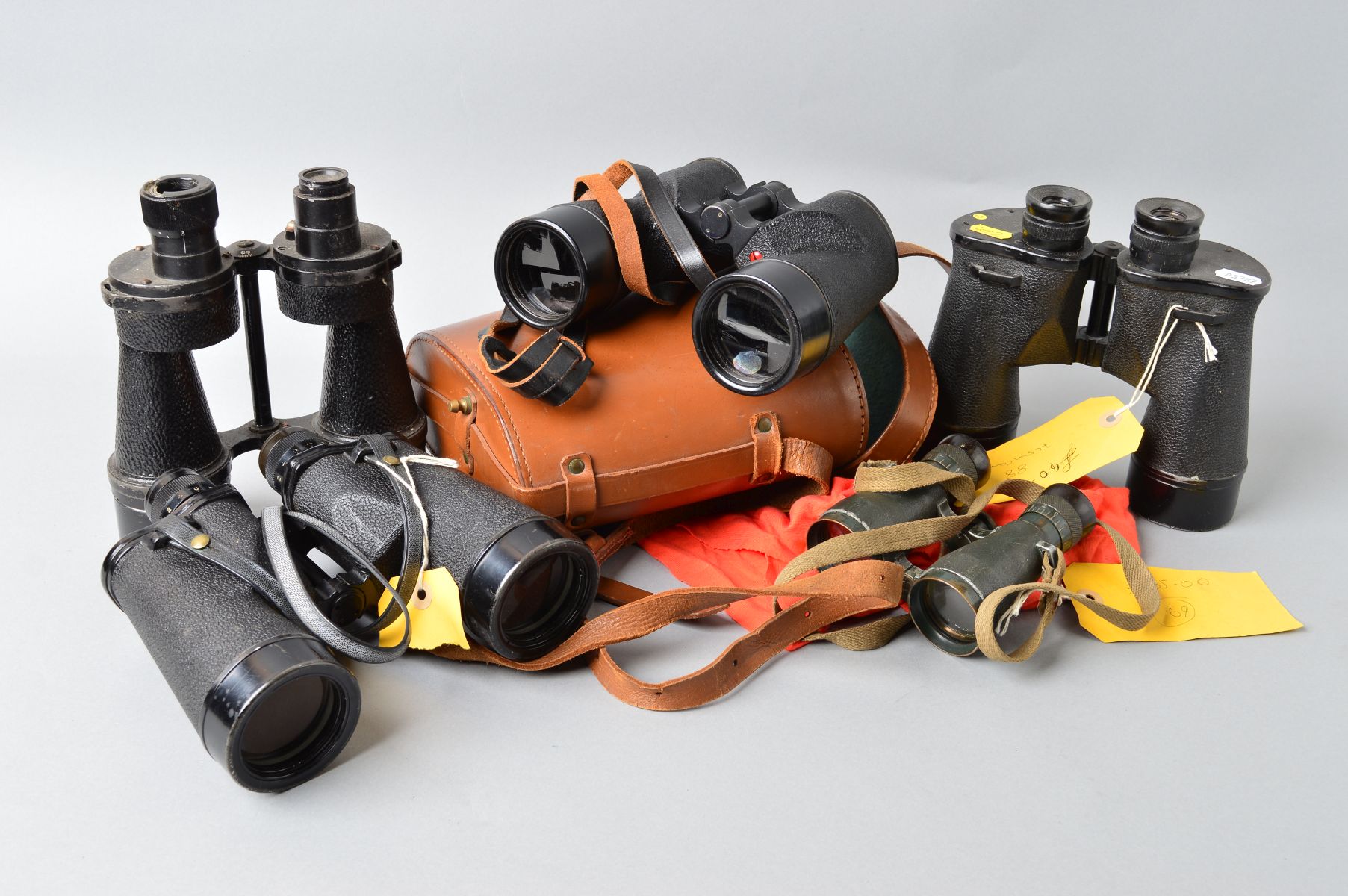 A BOX CONTAINING FIVE PAIRS OF MILITARY ISSUE FIELD BINOCULARS, as follows, U.S. Navy WWII era 7 x