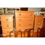 A PINE CHEST OF FOUR LONG DRAWERS, together with a similar pair of three drawer bedside chests (3)