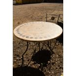 A CIRCULAR MARBLE TOPPED GARDEN TABLE with geometric inset decoration on an aluminium base, diameter
