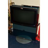 A BANG & OLUFSEN BEOVISION AVANT 30'' CRT on a metallic turquoise stand