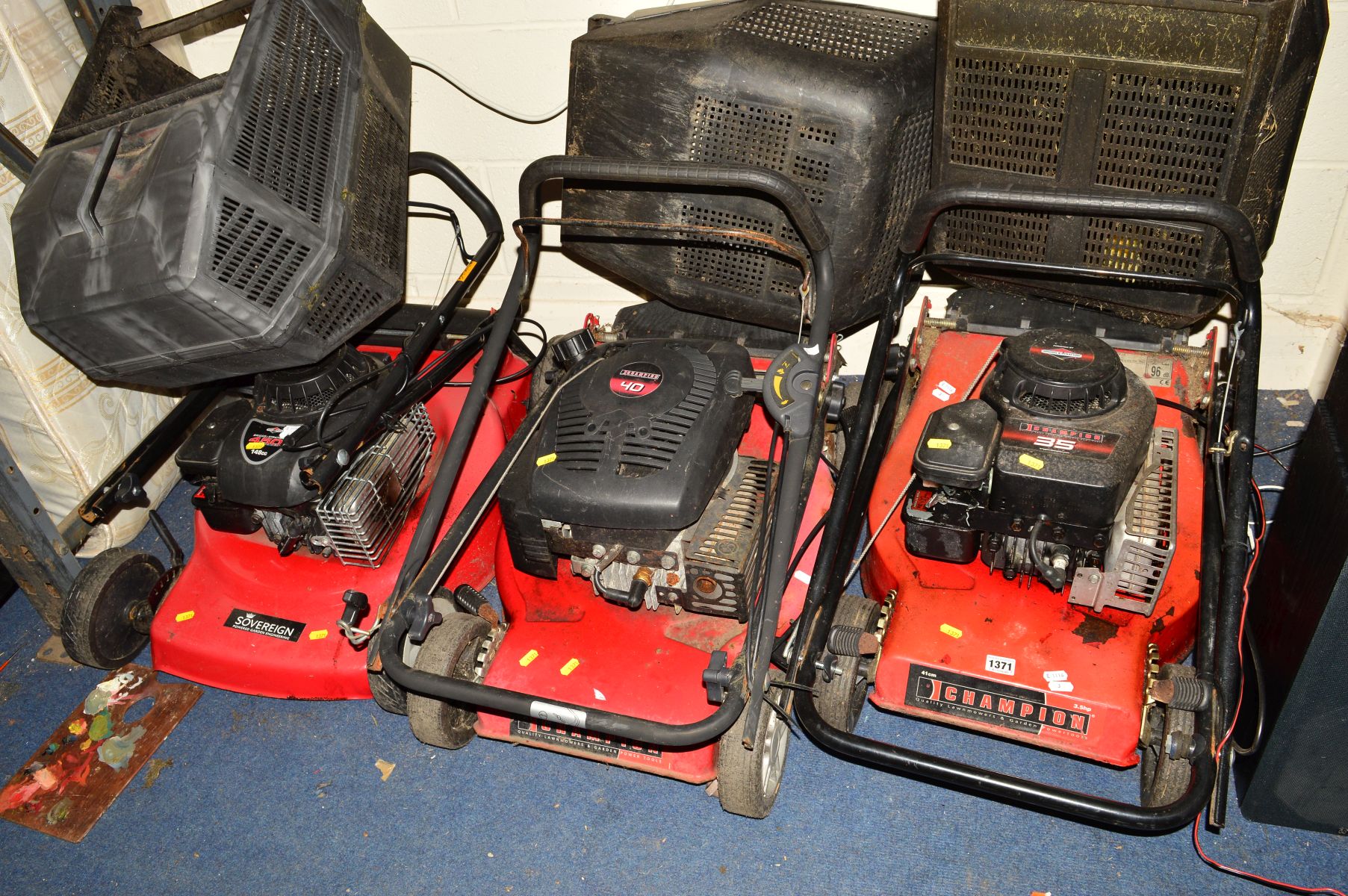 TWO CHAMPION LAWNMOWERS, together with a Sovereign lawn mower, all including grass boxes (3)