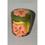 A MOORCROFT POTTERY COVERED CYLINDRICAL POT, 'Hibiscus' pattern on green ground, impressed marks