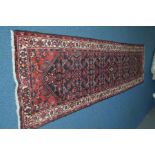 A 20TH CENTURY WOOLLEN AFSHAR CARPET RUNNER, black, red and cream ground, 402cm x 100cm