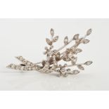 AN 18CT WHITE GOLD DIAMOND FLORAL SPRAY BROOCH, designed as a gathered bunch of flowers set with