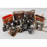SEVEN PAIRS OF MILITARY BINOCULARS, some with leather cases, no all matching the optics, makers