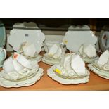 FOLEY CHINA WHITE TEAWARES, comprising two cake plates, milk jug, sugar bowl, twelve cups, twelve