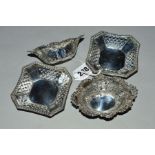 A PAIR OF EDWARDIAN SILVER BON BON DISHES OF WAVY OVAL FORM, embossed and pierced with foliate