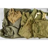 A BOX CONTAINING A MILITARY ISSUE GREEN BIVOUAC STYLE SLEEPING BAG, Air Crew trousers, Military