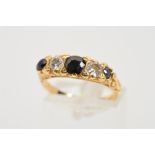 A SAPPHIRE AND DIAMOND FIVE STONE RING designed as a graduated row of three circular sapphires