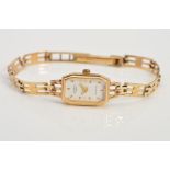 A LADY'S 9CT GOLD ROTARY WRIST WATCH, the elongated octagonal head with white face and baton hour