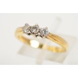 AN 18CT GOLD THREE STONE DIAMOND RING, designed as three brilliant cut diamonds within claw