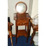 AN EDWARDIAN MAHOGANY VANITY CIRCULAR MIRROR, of a square form, single drawer on a tapering frame