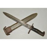 A WWII ERA USA ISSUE RIFLE BAYONET, complete with scabbard, good condition throughout