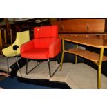 A SCANDINAVIAN STYLE RED UPHOLSTERED OFFICE ARMCHAIR, on a shaped chrome base, in the manner of Carl