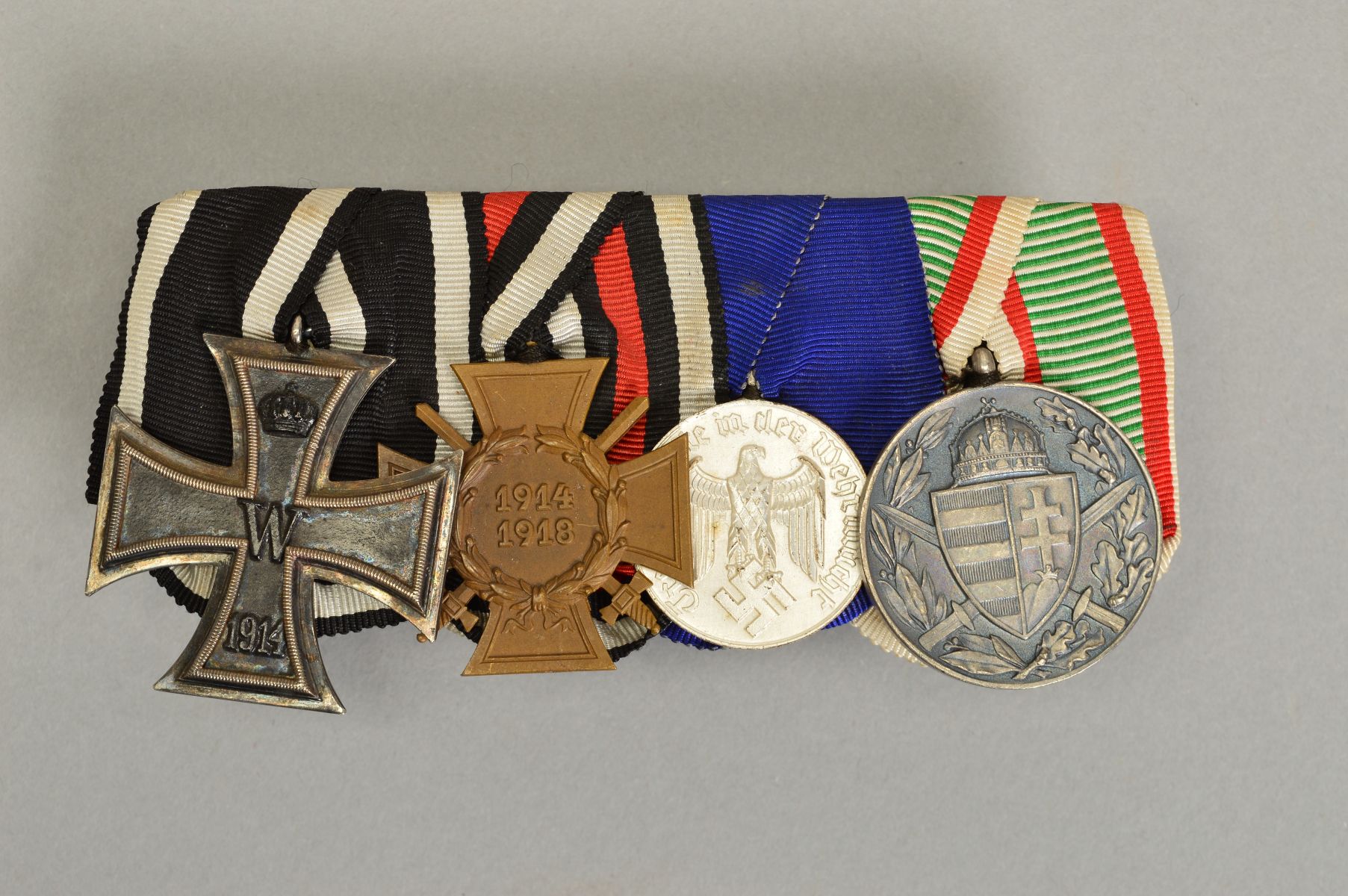 A WWI GERMAN MOUNTED GROUP OF FOUR MEDALS, as follows, Iron Cross, Hindenburg Cross with swords